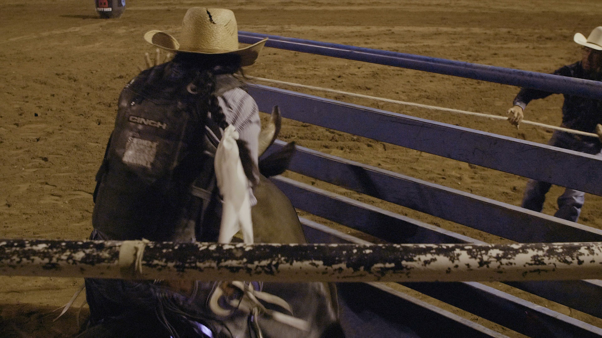 Man at rodeo, cover image from "Bucking on the Rez"